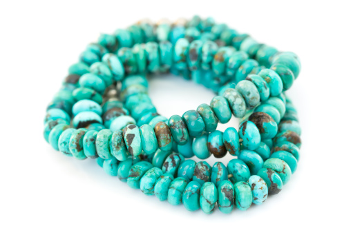 Navaho necklace made from turquoise beads.Isolated on white.More turquoise: