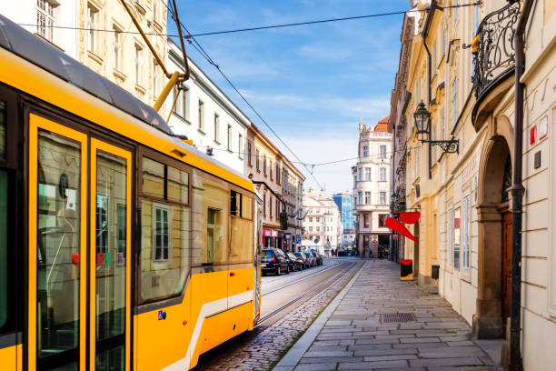 Narrow street with tram near the cathedral in Pilsen, Czech Republic Narrow street with tram near the cathedral in Pilsen, Czech Republic pilsen stock pictures, royalty-free photos & images
