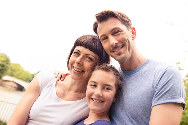 istock happy family embracing togetherness 181891896