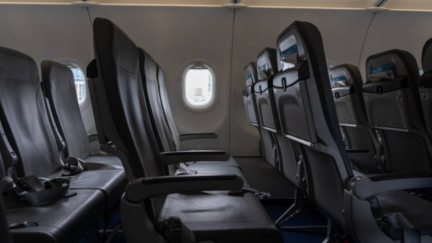 istock Empty airplane seats in the cabin 1818924410