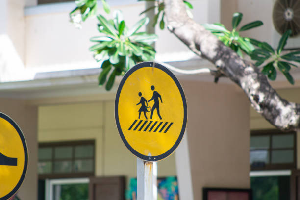 Pedestrian sign on the road in public park stock photo