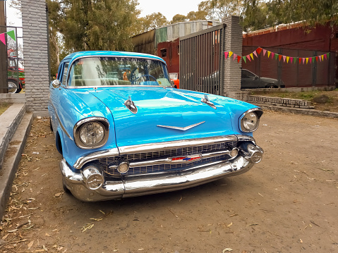 Lanús, Argentina - Sept 24, 2023: Old sky blue 1957 Chevrolet Chevy Bel Air sport sedan two door at a classic car show in the a park. Front view