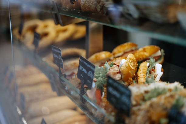 A close-up picture shows the delicate and precise details of fresh pastries in a bakery, from the glossy finishes to the flaky layers, each element a work of edible art