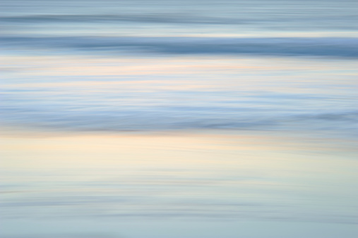 Colors of ocean at dawn (long exposure with panning)