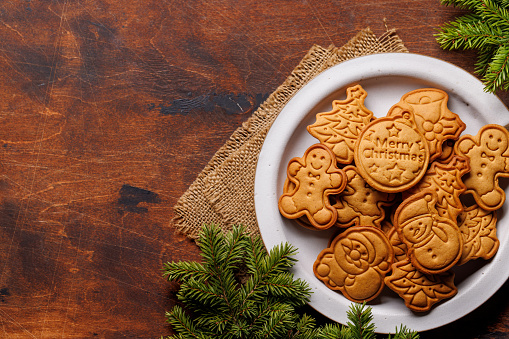 Diverse Christmas gingerbread cookies, festive sweetness. Flat lay with copy space