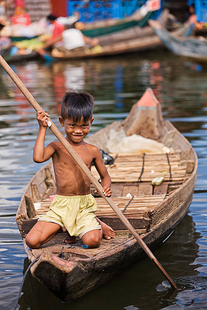 istock Little boy in the boat, Cambodia 181894893