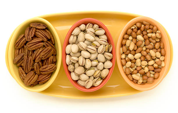 Dishes of nuts stock photo