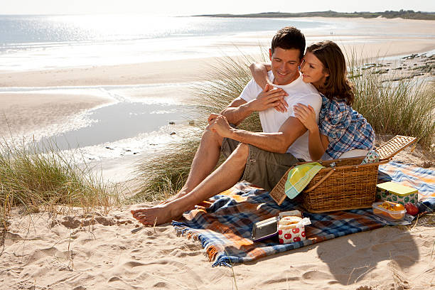 istock Couple on a sand dune 181895259
