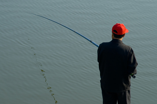 Relaxed man fishing.