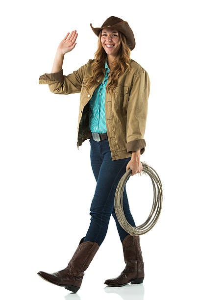 istock Attractive cowgirl waving hands 181895837