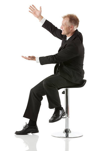 istock Businessman sitting on a chair and gesturing 181896000