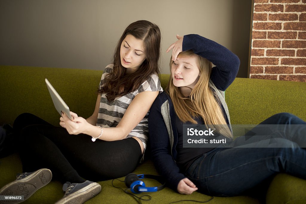 connected friends best friends on their digital tablet Beautiful People Stock Photo