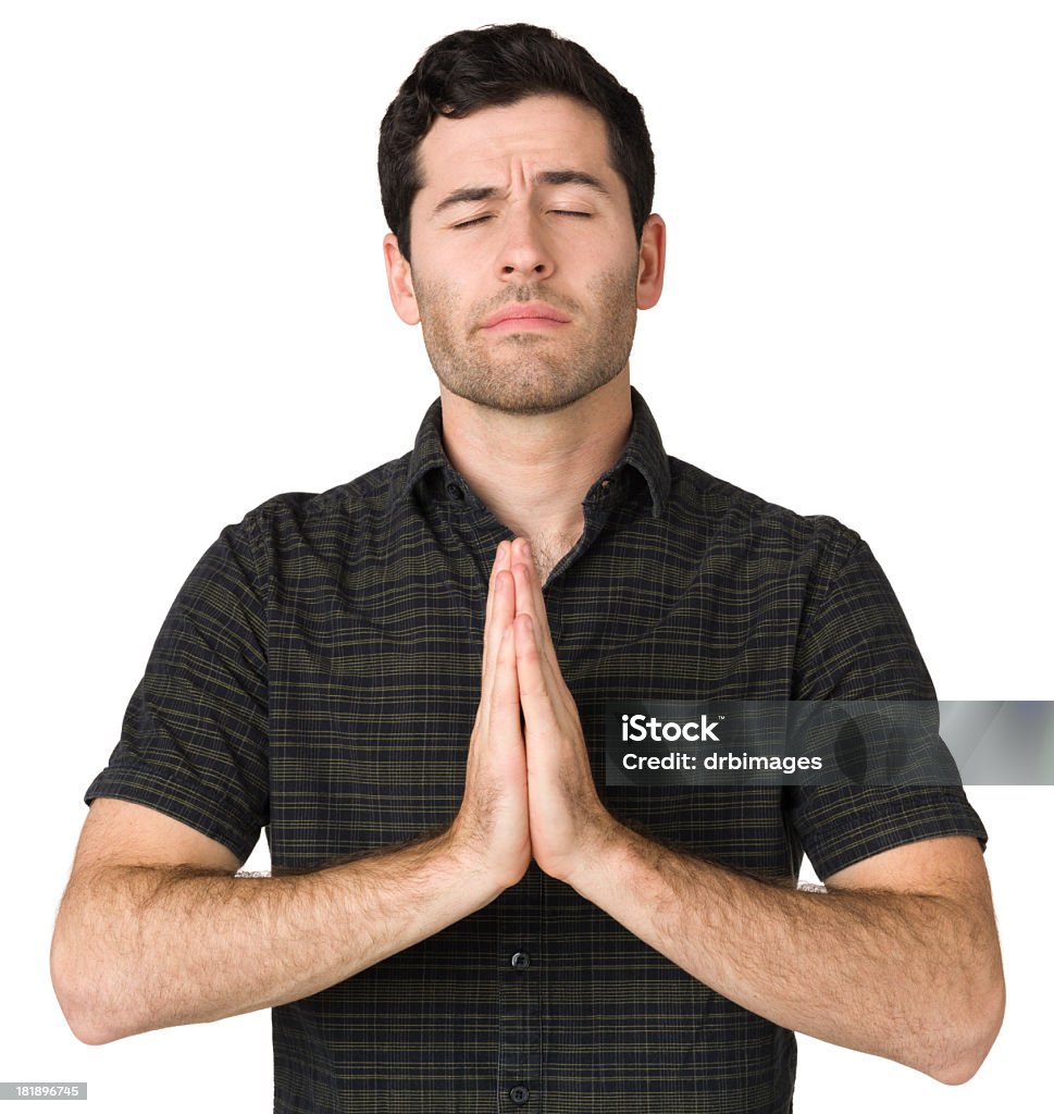 Praying Young Man Portrait of a young caucasian man on a white background. 20-24 Years Stock Photo