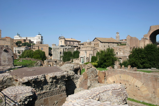 Trajan's Column at the Imperial Forums in Rome with the Basilica of the XII Santi Apostoli in the background