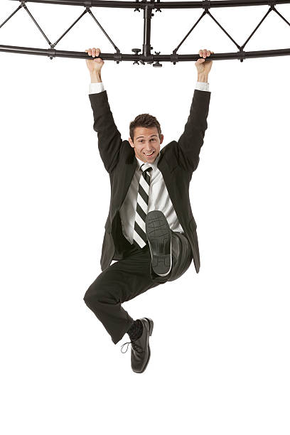 istock Businessman hanging from a metal structure 181896938