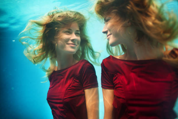 Young woman underwater stock photo