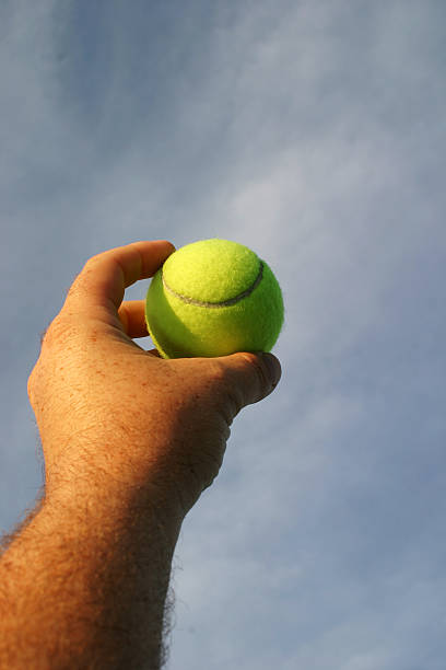 istock Tennis ball in hand 181897823