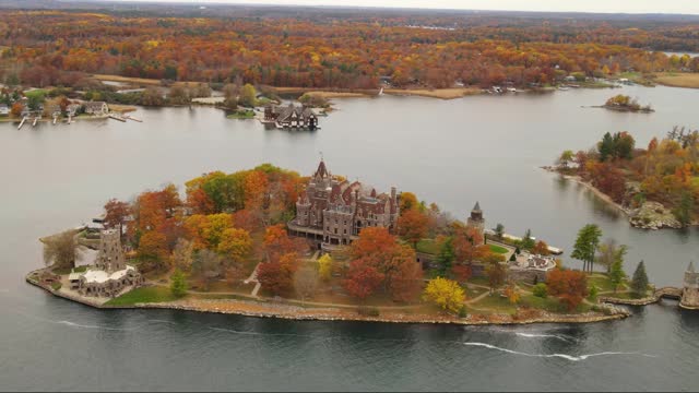 castle on an island with colorful autumn trees on it in New York state