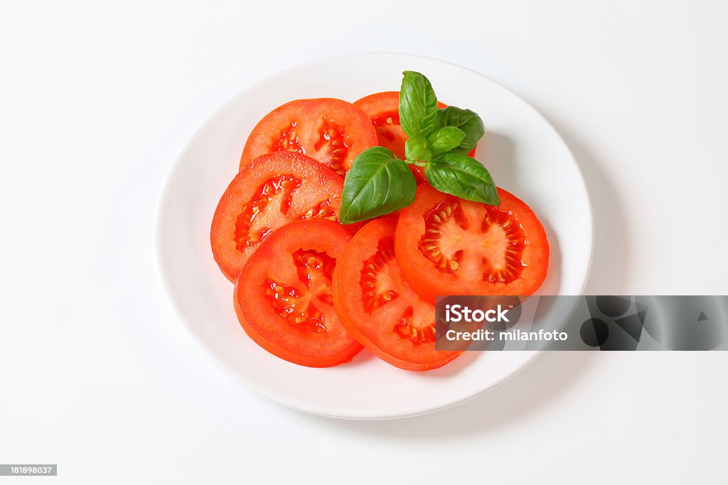 Rebanadas de tomate - Foto de stock de Albahaca libre de derechos