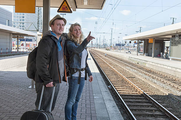 istock young casual couple travelingwith train 181898568