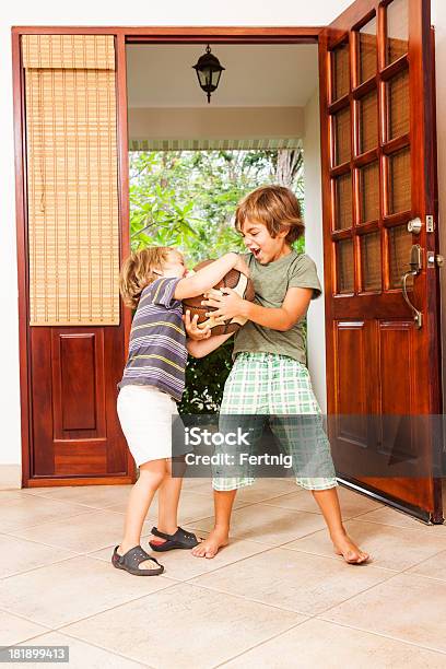 Two Brothers Fighting Over A Ball Stock Photo - Download Image Now - Arguing, Boys, Brother