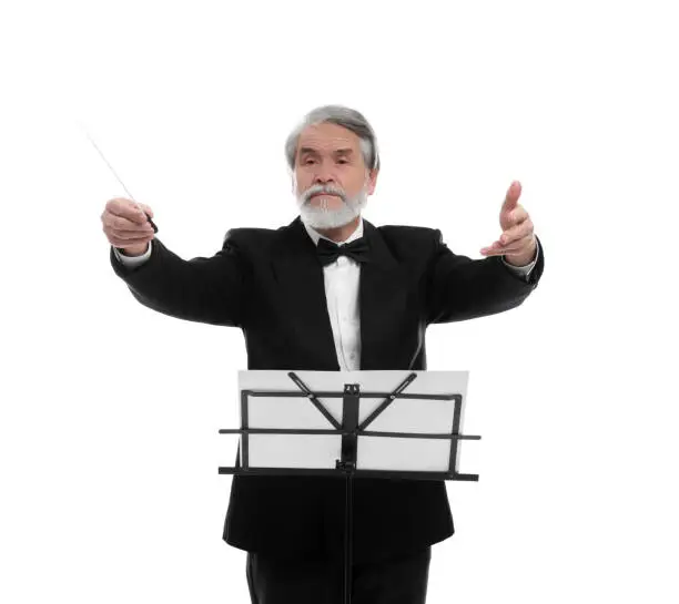 Photo of Professional conductor with baton and note stand on white background