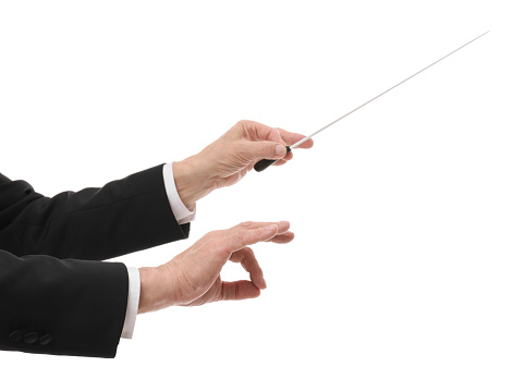 Professional conductor with baton on white background, closeup