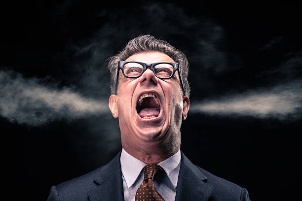 Shouting Businessman with Steam Jets Blowing out of his Ears stock photo