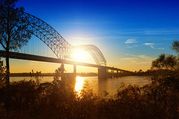 Memphis, Sunset over the Mississippi River Sunset view of the I-40 bridge crossing the Mississippi River at Memphis.More images from Memphis in the lightbox: memphis tennessee stock pictures, royalty-free photos & images
