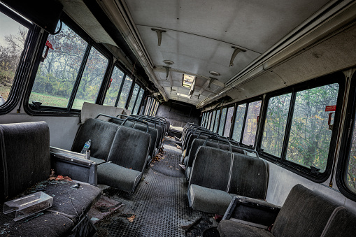 Rockville, Indiana, USA - October 29, 2023: Abandoned bus interior on the grounds of the Indiana State Sanatorium