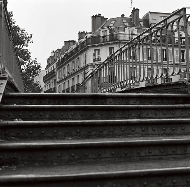 One of the bridges over the Canal St Martin, Paris. Overcast morning, November 2012. Scan from 120-Ilford HP5+ (some film grain visible)