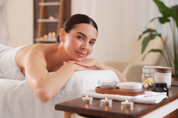 istock Young woman resting on massage couch in spa salon 1819011009