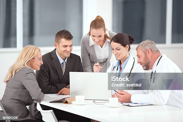 Doctors On Business Meeting Stock Photo - Download Image Now - Business Meeting, Businesswoman, Doctor