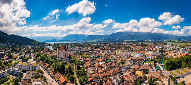 Panorama of Thun city with Alps and Thunersee lake, Switzerland. Historical Thun city and lake Thun with Bernese Highlands swiss Alps mountains in background, Canton Bern, Switzerland.
