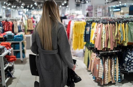 woman shopping in clothes store