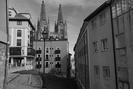 Burgos, Spain, Oct. 22, 2023: view of Burgos cathedral between houses, Burgos, Spain.