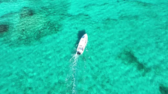 Aerial Paradise: Boating the Turquoise Waters of Turks and Caicos.