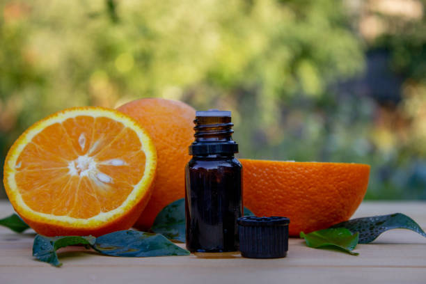 istock Essential extract of orange oil in a small bottle. Selective focus. 1819062649