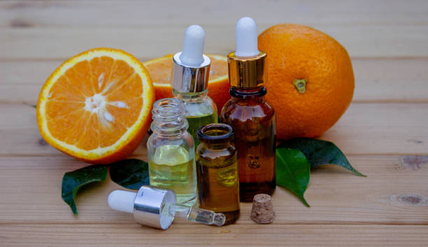 istock Essential extract of orange oil in a small bottle. Selective focus. 1819062675