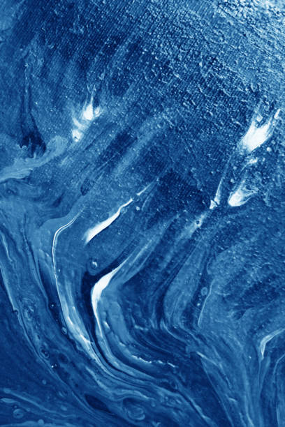 Abstract blue acrylic background. Blue brush strokes on canvas.Abstract fluid acrylic painting. Modern art. Marbled blue abstract background. Liquid marble pattern