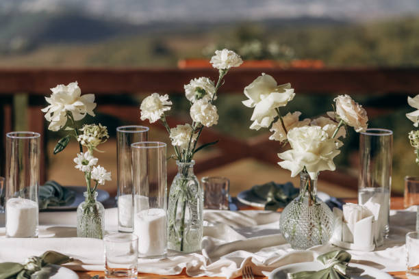 The wedding table decorated with fresh flowers.