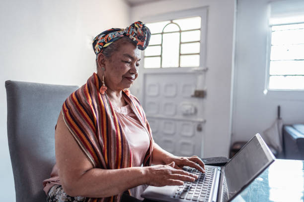istock Senior woman using laptop at home 1819210172