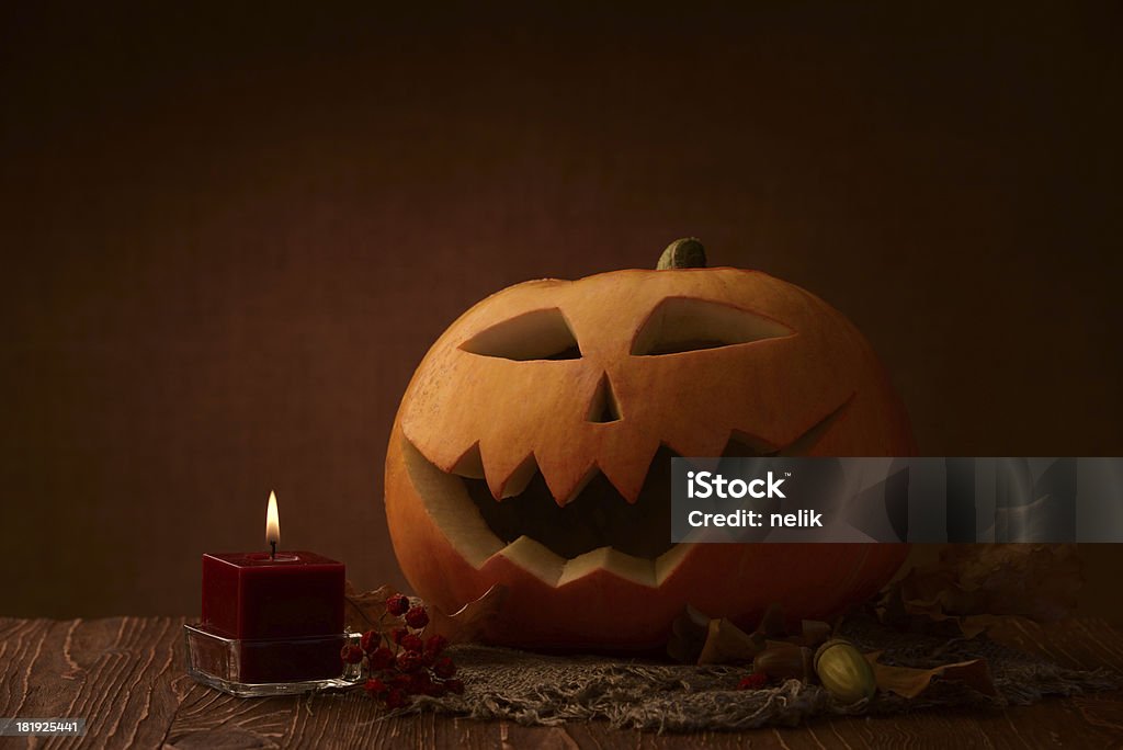 Scary halloween pumpkin jack-o-lantern Scary halloween pumpkin jack-o-lantern on dark background Anthropomorphic Stock Photo