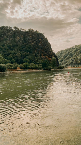 Scenic Medieval German Landscape as Viewed from the Rhine River Traveling along the Rhine River with scenic views of the medieval landscape of St. Goarshausen, Germany and the Lorelei slate rock. This cultural landscape is located within the Rhine Gorge (Middle Rhine) and a UNESCO World Heritage Site. slate ridge stock pictures, royalty-free photos & images