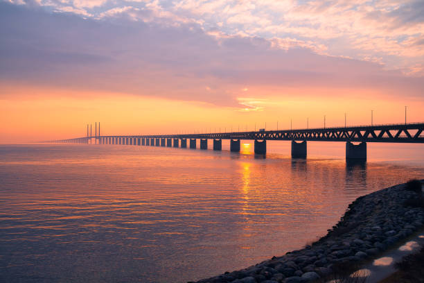 The Oresund bridge between Sweden and Denmark The Oresund Bridge is a combined motorway and railway bridge between Sweden and Denmark oresund bridge stock pictures, royalty-free photos & images