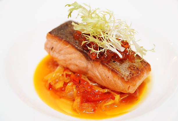 istock Salmon steak with roe and vegetable stew, close-up 181925909