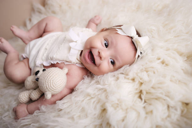 istock baby girl posing and smiling 1819272187