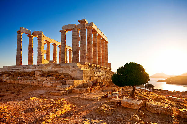 A view of the Temple of Poseidon at Cape Sounion, Greece Greece. Cape Sounion - Ruins of an ancient Greek temple of Poseidon before sunset ancient greece stock pictures, royalty-free photos & images