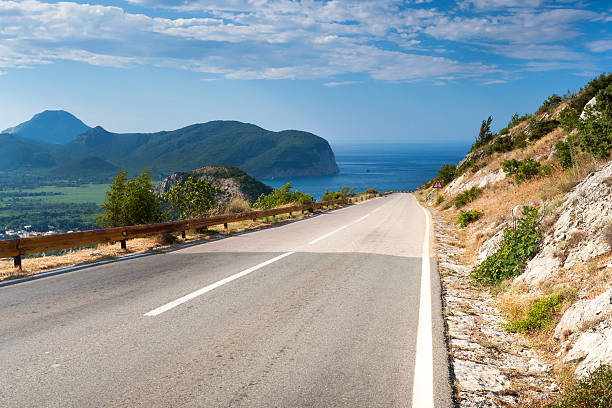 istock Mountain road with blue sky and sea on a background 181928705