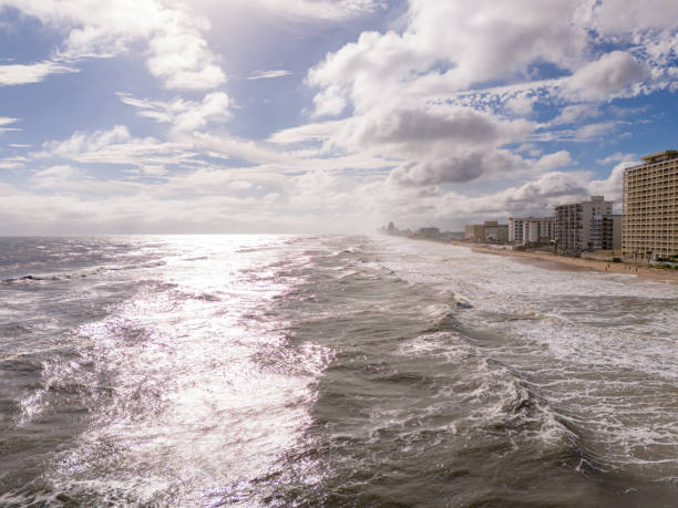 istock Ocean waves on the beach with bright sun 1819297563